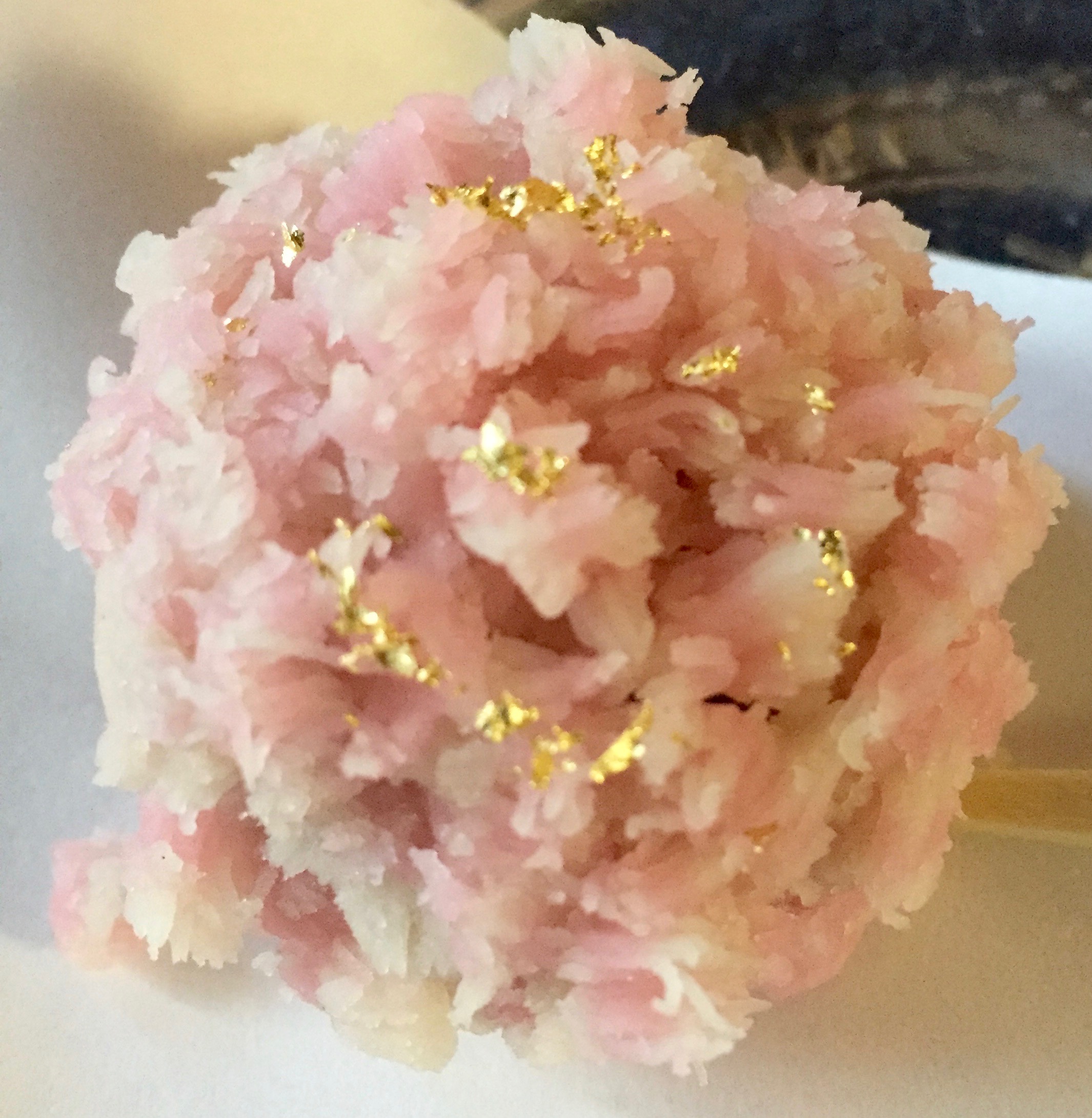 Pink confection with gold flakes